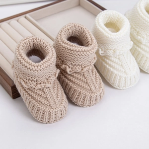 Hand-knitted warm cotton baby socks in khaki and cream white for infants and newborns