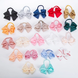 Detailed grid view of 20 colors embroidered grosgrain bow headbands for infant girls