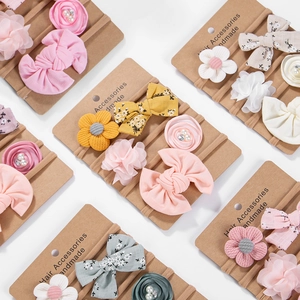 Detailed view of handmade chiffon floral baby headbands with soft elastic nylon straps