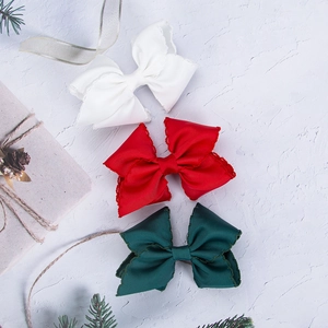 Rainbow striped grosgrain bow hair clips in red, white and green for girls' hair styling