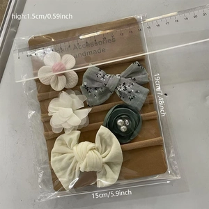 Detail view of 5-piece baby flower headbands set showing 15x19cm packaging dimensions