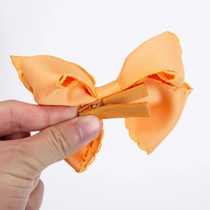 Handmade orange rainbow ribbon bow hair clip with fully fabric-wrapped alligator clip