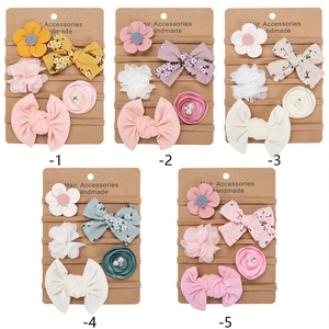 Five sets of colorful chiffon flower and bow headbands for infant girl photography
