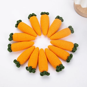Detailed close-up of twelve handmade crochet carrots arranged in a circle on white background