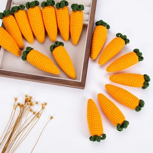 Handmade crochet orange carrots with green leaves for Easter decorations and photo props