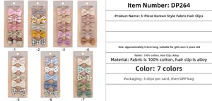 Close-up of 5.5cm handmade cotton bow hair clips set with floral and polka dot patterns