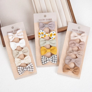 Handmade 15-piece cotton bow hair clip set with floral and polka dot patterns