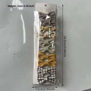 Détail du lot de 10 barrettes à nœuds en coton aux motifs floraux et à carreaux