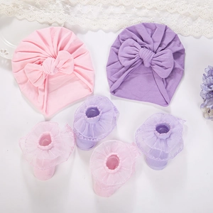 Detailed set of cotton baby turbans with lace trim socks in soft pink and purple colors
