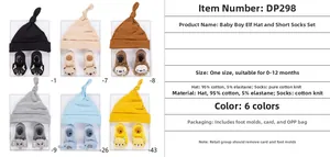 Detail of soft cotton baby beanie and matching animal socks set for infants