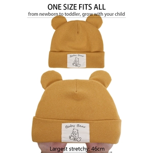 Detail showing the high elasticity and soft knit texture of the ginger baby bear beanie