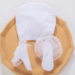 Infant pure cotton set featuring a lace-trimmed round cap and matching lace-edged socks