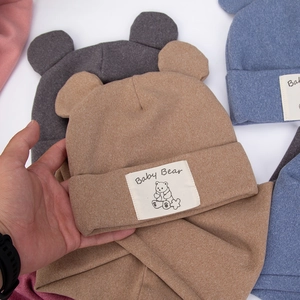 Detail of baby bear knitted hat showing soft elastic fabric and bear ears design