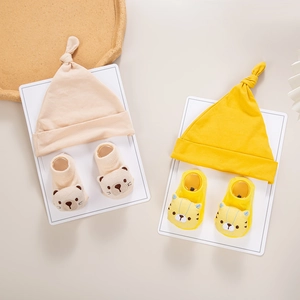 Knitted baby turban hat and matching 3D animal socks set in beige and yellow tones
