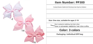 Detail showing three shades of pink polyester bow hair clips with white alloy clips