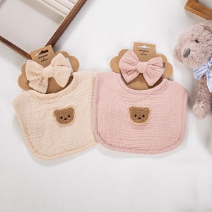 Detail of 4-layer cotton gauze baby bibs and headbands set with cute plush bear patch
