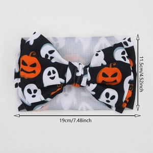 Halloween baby headband with pumpkin ghost print and large bow measuring 19cm by 11.5cm