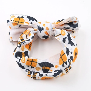 Halloween baby headband with bats and pumpkin prints on textured bow fabric