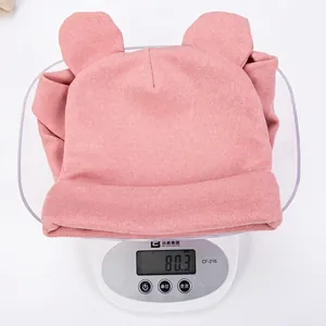 Pink infant knitted beanie with cute bear ears weighing approximately 80.3 grams