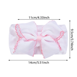 White nylon baby headband with scalloped bow detail and dimensional size measurements