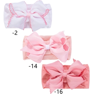 Three-piece baby bow headband set with soft elastic nylon fabric in white and pink tones
