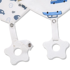 Close-up of baby cotton bandana bib featuring car prints and star silicone teether detail