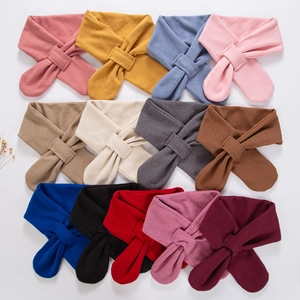 Thirteen assorted soft knit baby scarves with convenient cross-hole fastening design