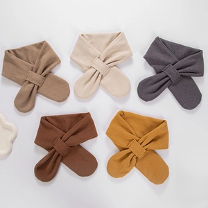 Detail view of five assorted earth-tone cashmere-like knitted neck scarves for babies