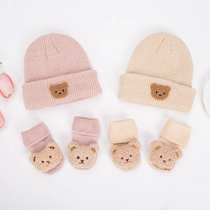 Knitted baby hat and socks set with 3D teddy bear patches in pink and beige colors