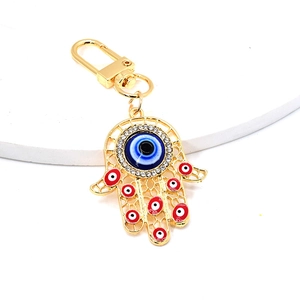 Detailed view of Hamsa Hand keychain with colorful evil eye charms and rhinestones