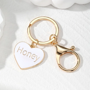 Golden Honey heart keychain with white enamel charm and lobster clasp for bags