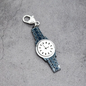 Detail of blue enamel watch pendant with heart-shaped silver lobster clasp