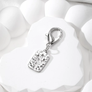 Detail of silver rectangle cactus pendant with hammer texture on white stone