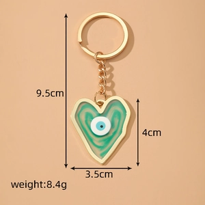 Golden Evil Eye heart keychain with green marble resin inlay and 9.5cm length dimensions