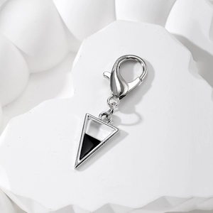 Detail of silver alloy triangle charm with black enamel and secure lobster clasp hook