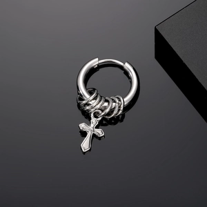 Detail shot of vintage punk silver stainless steel huggie earring with cross pendant