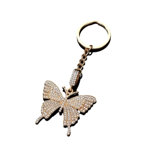 Elegante portachiavi a farfalla dorato con strass bianchi e riflesso nitido