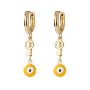 Detail of gold evil eye and Venus symbol charm on stainless steel hoop earrings