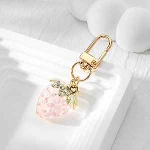 Transparenter Erdbeere-Schlüsselanhänger in Pink mit Kristallen und Golddetails