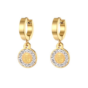 Macro detail of gold-plated Saint Benedict religious earrings with white zirconia stones
