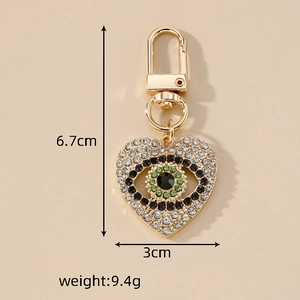 Porte-clés tendance en forme de cœur avec œil protecteur et strass étincelants