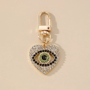 Porte-clés cœur à l'œil maléfique avec cristaux brillants et fermoir mousqueton doré
