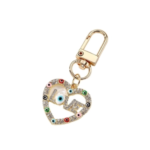 Golden heart keychain with LOVE cutout, sparkling rhinestones and colorful evil eye charms