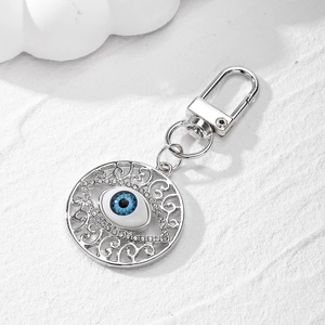 Vintage evil eye keychain with hollow metal pattern and shiny rhinestones decoration