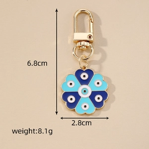 Detail showing dimensions of blue evil eye flower heart keychain, 6.8cm long and 8.1g weight