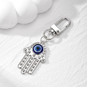 Vintage Hamsa Hand Evil Eye Keychain with silver metal finish and blue resin bead detail