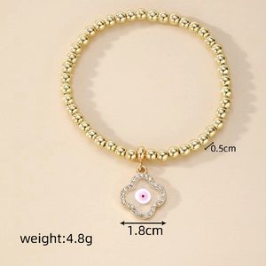 Detail of beaded evil eye bracelet showing dimensions 0.5cm beads and 1.8cm clover charm