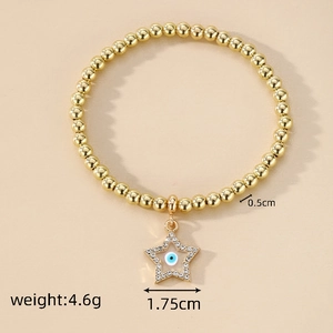 Detail of a 4.6g gold beaded stretch bracelet with a 1.75cm zircon-encrusted evil eye star charm