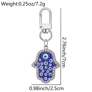 Detail view of Hamsa Hand keychain with dimensions 7x2.5cm and weight of 7.2 grams