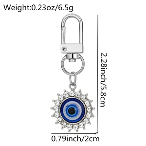 Detailed view of silver evil eye keychain dimensions with crystal studs and spring clasp